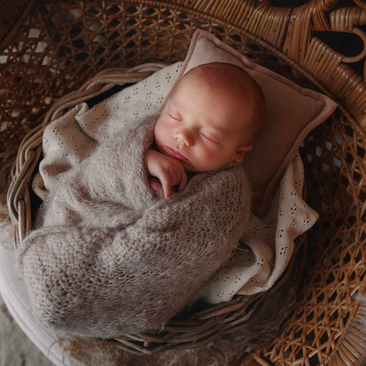 Eden participe au concours pour gagner de l'argent avec cette photo : baby, basket, bed, blanket, clothing, cradle, crib, face, furniture, head, infantbed, knitwear, newborn, person, photography, portrait, sleeping, sweater