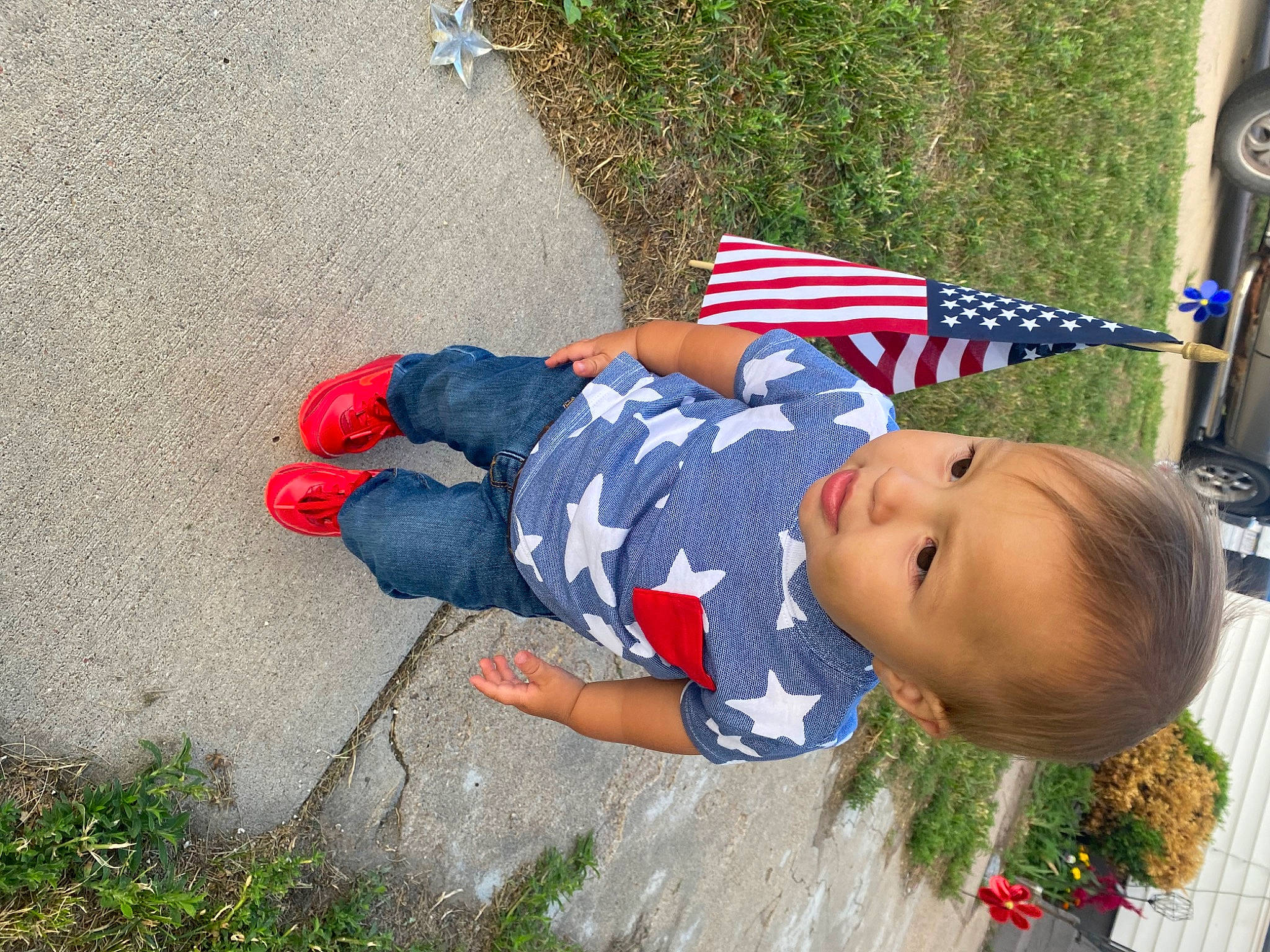 Legacy is registered to the contest to win money with this photo: carmine, child, electric_blue, event, flag, flag_day_usa, flag_of_the_united_states, fun, grass, hat, leisure, people_in_nature, person, plant, play, sitting, tire, toddler, tree, wheel
