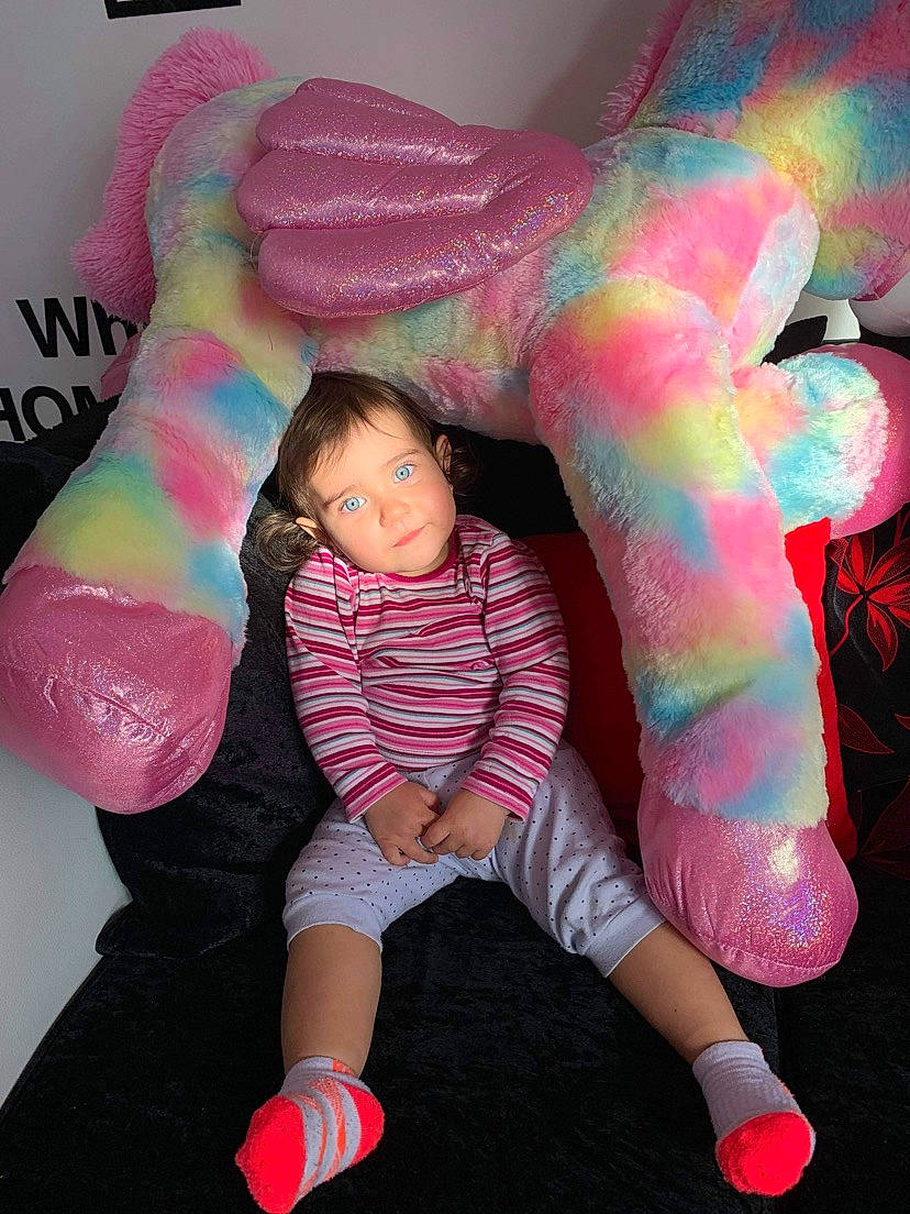 Rebecca is registered to the contest to win money with this photo: arm, cool, eye, facial_expression, fashion, finger, gesture, head, human_body, joint, leg, magenta, material_property, person, pink, red, skin, sleeve, textile, thigh