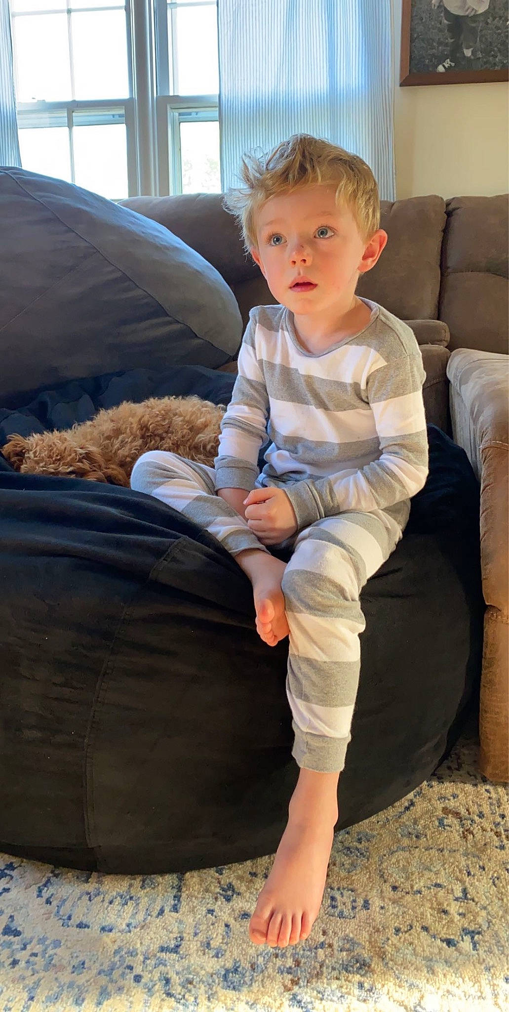 Reece joined the competition — help win amazing prizes! automotive_tire, baby_toddler_clothing, barefoot, comfort, couch, elbow, flooring, foot, fun, human_leg, joint, knee, lap, leg, person, sitting, sleeve, surprise, t_shirt, thigh