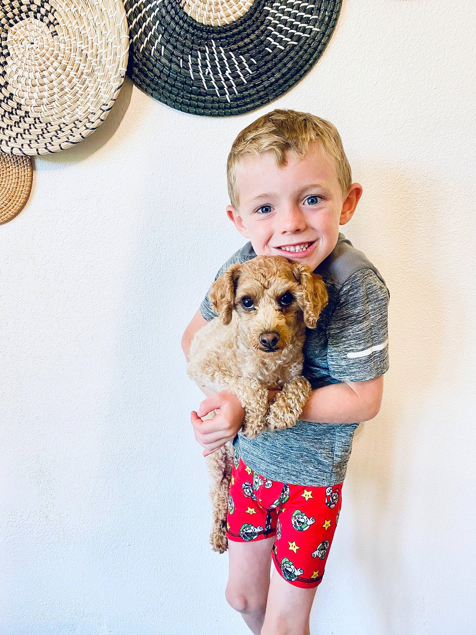 Reece joined the competition — help win amazing prizes! carnivore, child, clothing, companion_dog, denim, dog, dog_breed, fawn, happy, hat, joy, pattern, person, shorts, sleeve, smile, sporting_group, sunglasses, t_shirt, thigh