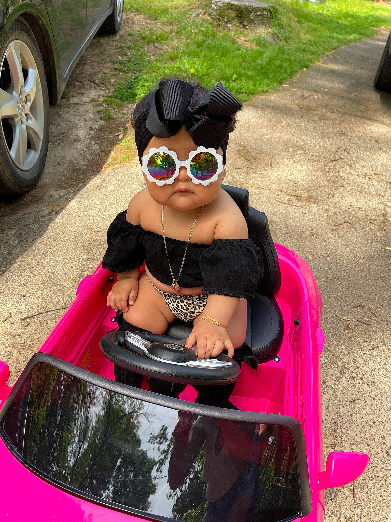 Kali joined the competition — help win amazing prizes! automotive_design, automotive_lighting, automotive_tire, black_hair, bumper, car, eyewear, glasses, goggles, hood, motor_vehicle, person, pink, sunglasses, tire, toy, vehicle, vehicle_door, vision_care, wheel