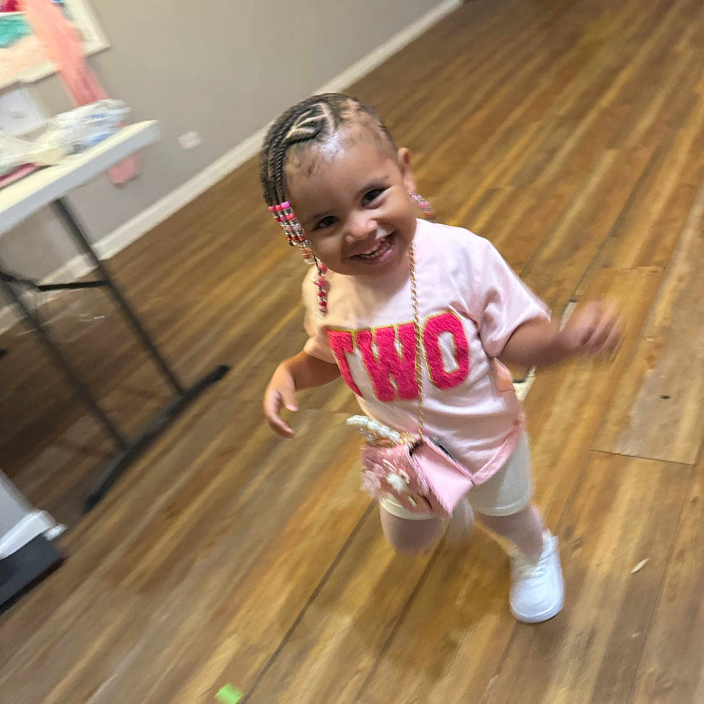 Zaylani is registered to the contest to win money with this photo: accessories, baby, bodypart, clothing, face, finger, footwear, hand, hardwood, head, indoors, interiordesign, jewelry, necklace, person, photography, plywood, portrait, shoe, wood