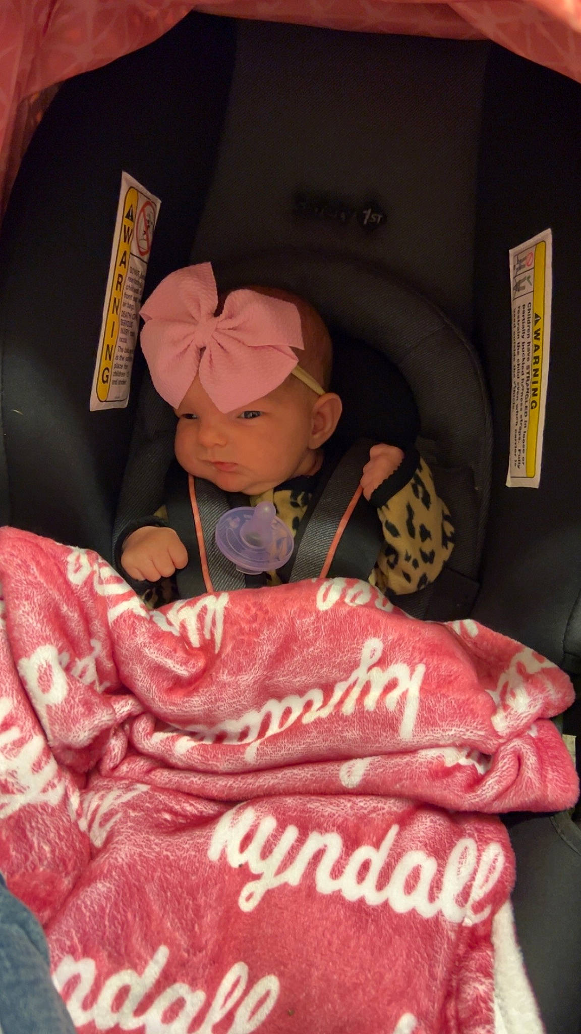 Kyndall is registered to the contest to win money with this photo: bed, bed_sheet, bedding, car_seat, carmine, comfort, flesh, font, fur, headwear, linens, magenta, peach, person, pink, plush, room, sleeve, stuffed_toy, sweetness