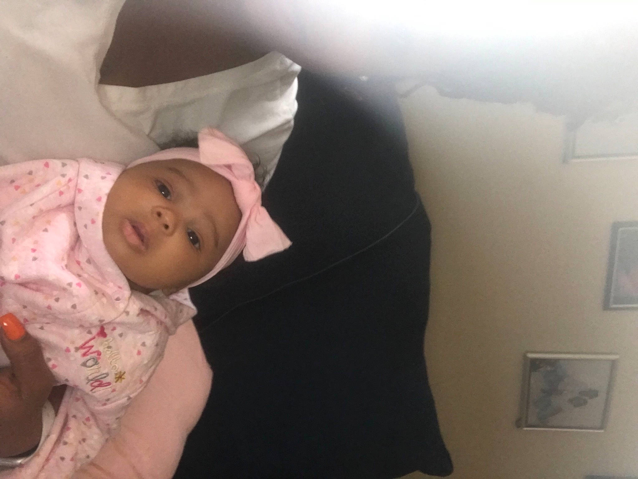 Saharah is registered to the contest to win money with this photo: abdomen, baby, bedding, child, headwear, linens, neck, person, room, skin, toddler, trunk