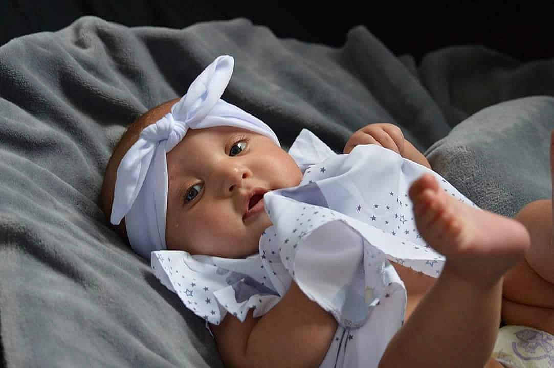 Nevaeh joined the competition — help win amazing prizes! baby, bonnet, child, childbirth, headwear, person, toddler