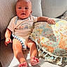 Noah is registered to the contest to win money with this photo: baby, infant, couch, pillow, sunlight, indoor, comfort, clothing, child, face, hand, foot, texture, pattern, relaxation, home, person, smile, cute, toddler