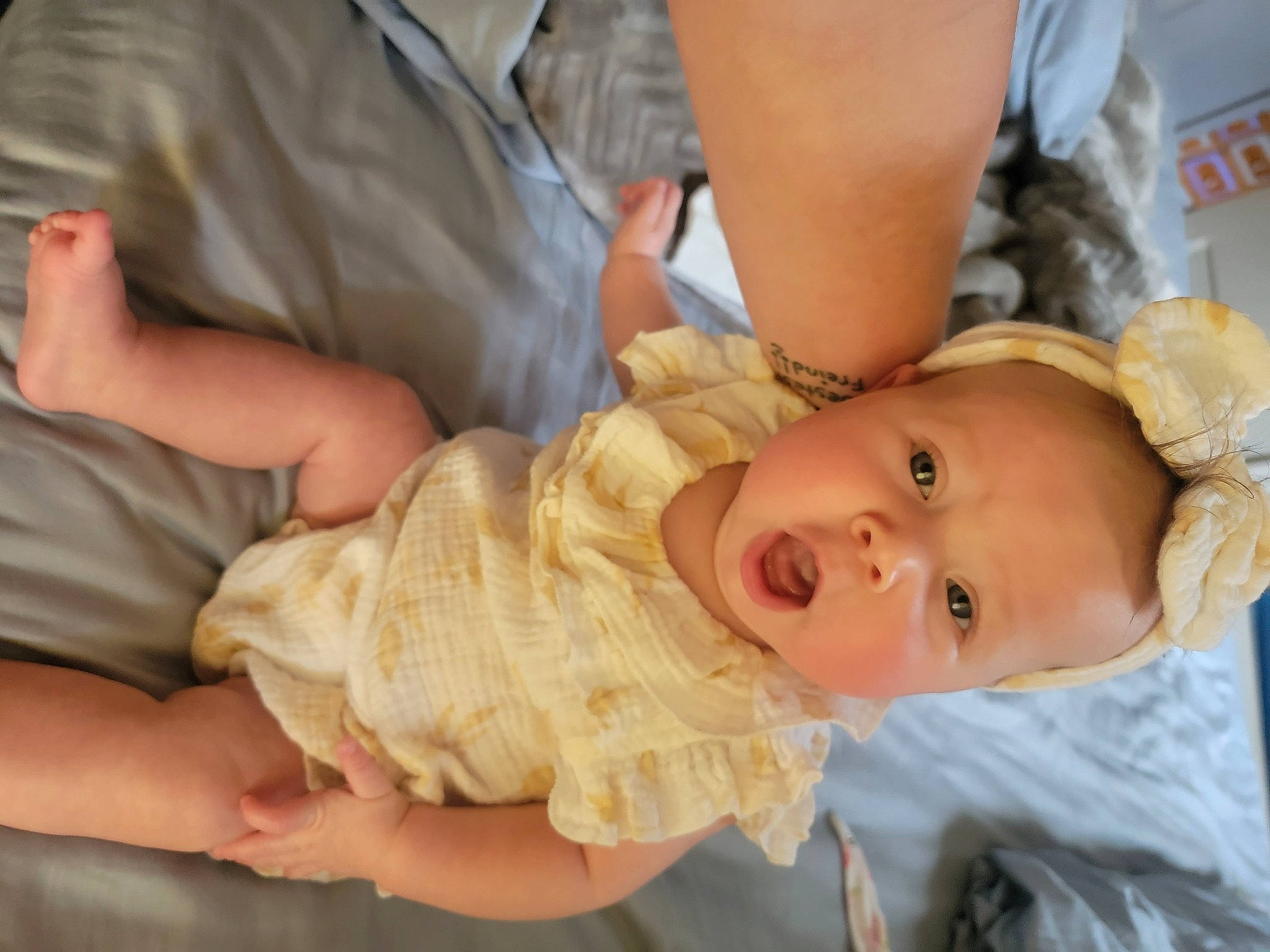 Rózaleigh is registered to the contest to win money with this photo: baby, baby_toddler_clothing, cheek, child, comfort, dress, ear, embellishment, eyelash, finger, gesture, hand, happy, hat, iris, nose, person, skin, thumb, toddler