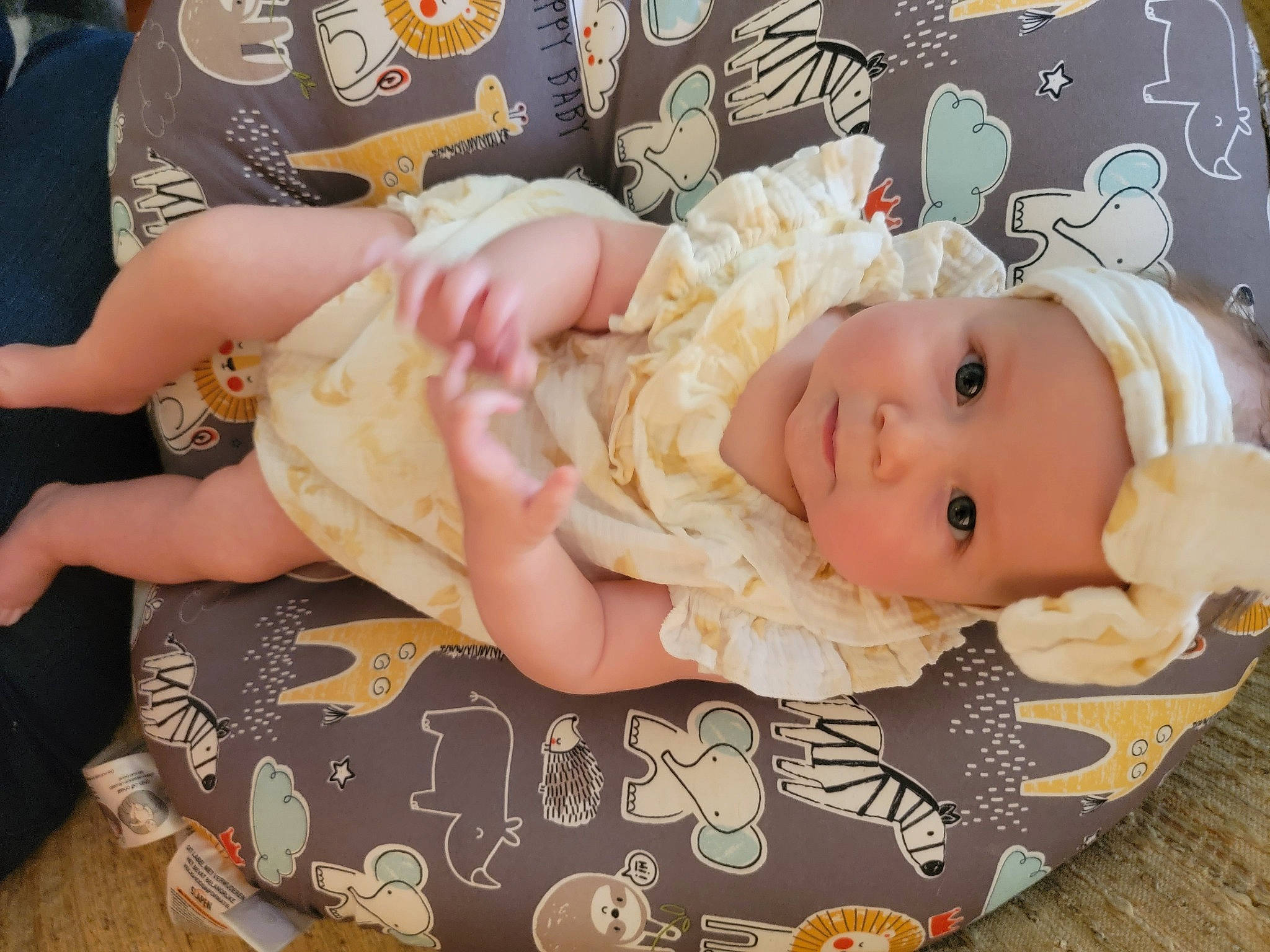 Rózaleigh is registered to the contest to win money with this photo: baby, baby_products, baby_safety, baby_toddler_clothing, cheek, child, comfort, eye, facial_expression, fashion_accessory, hair_accessory, head, headgear, headwear, linens, pattern, person, pink, room, skin