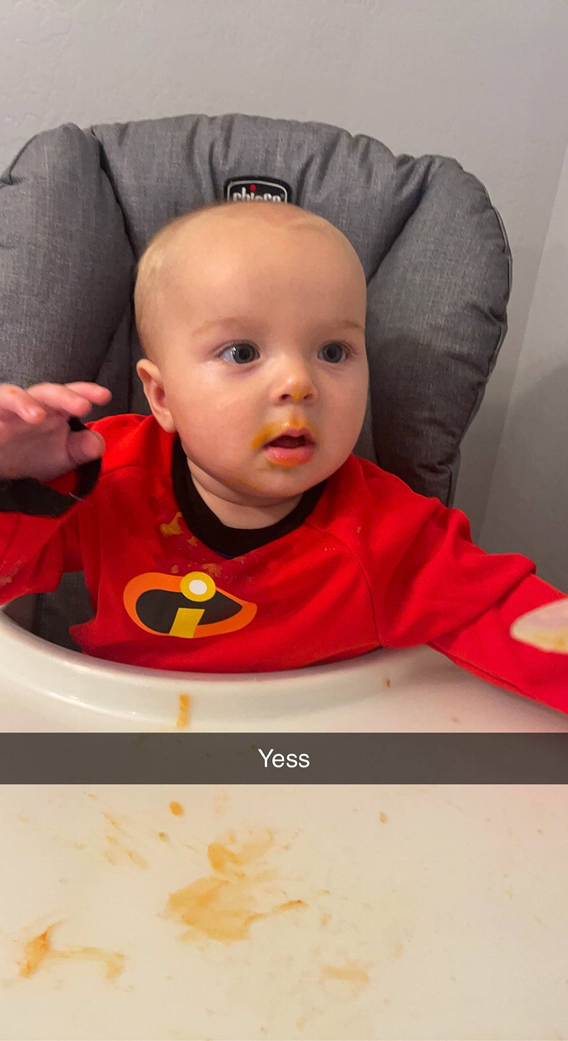 Colt is registered to the contest to win money with this photo: baby, baby_toddler_clothing, bib, chair, cheek, child, chin, comfort, eye, eyebrow, facial_expression, happy, lip, mouth, nose, outerwear, person, product, sleeve, t_shirt