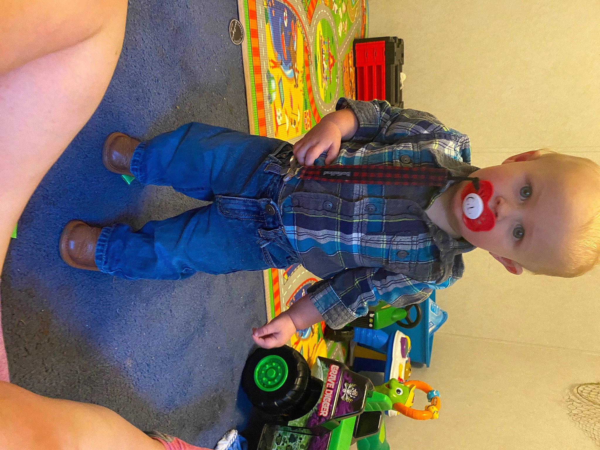 Cayson is registered to the contest to win money with this photo: arm, azure, baby, baby_products, child, electric_blue, foot, fun, gesture, head, human_leg, joint, nail, orange, pattern, person, room, surprise, thigh, thumb