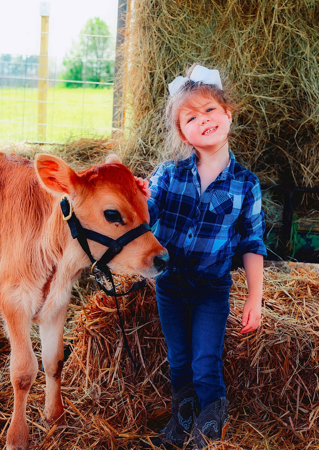 Aliza joined the competition — help win amazing prizes! child, dairy_cow, dress, fawn, goat, grass, grassland, grazing, happy, head, human_leg, joy, landscape, livestock, people_in_nature, person, plant, rural_area, terrestrial_animal, toddler