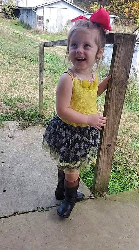 Harper joined the competition — help win amazing prizes! baby_toddler_clothing, dress, eye, face, fence, grass, happy, head, human_leg, joy, knee, pattern, person, pink, plant, shoe, sleeve, smile, street_fashion, summer