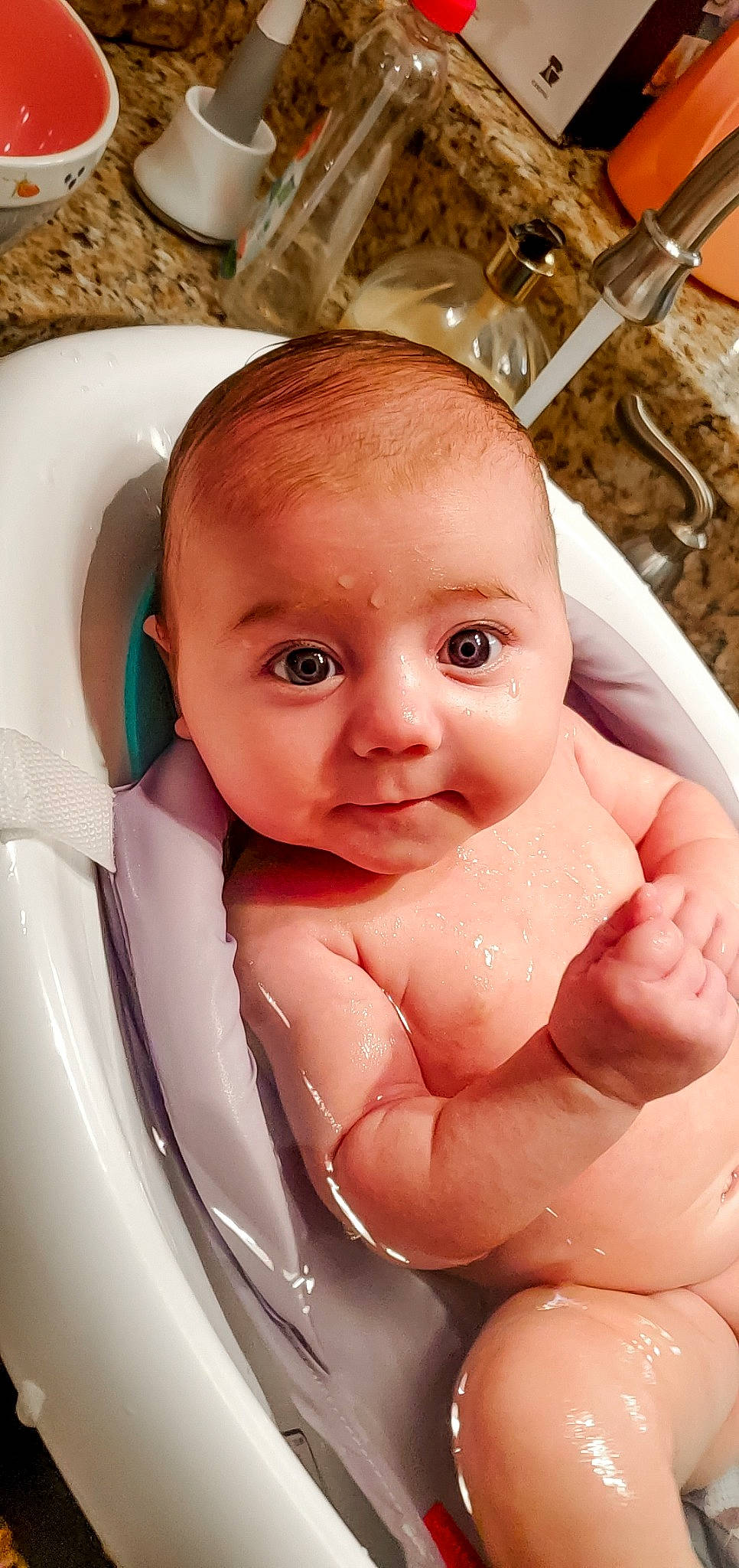 Maeve is registered to the contest to win money with this photo: arm, baby, baby_bathing, bathing, cheek, chest, eye, eyebrow, eyelash, finger, fluid, gesture, iris, jaw, lip, mouth, neck, nose, person, skin