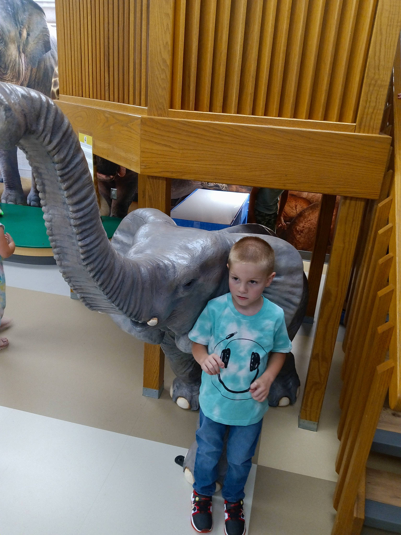 Jason joined the competition — help win amazing prizes! art, baby_toddler_clothing, child, dinosaur, engineering, fun, gesture, hardwood, leisure, person, product, room, standing, t_shirt, toddler, wood, wood_stain