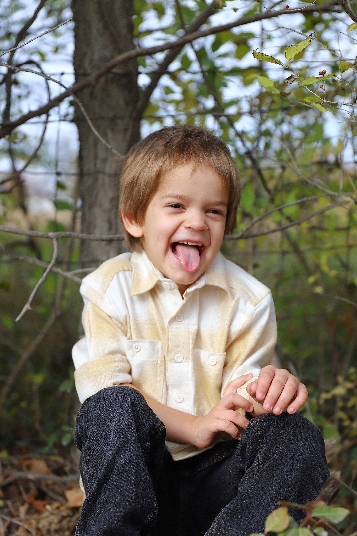 Tobias is registered to the contest to win money with this photo: blond, child, flash_photography, forest, fun, grass, happy, pattern, people_in_nature, person, plant, portrait, sitting, sky, sleeve, smile, soil, spring, toddler, tree