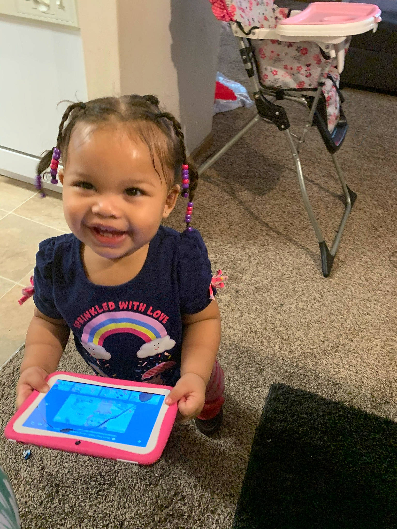 Amira is registered to the contest to win money with this photo: baby, baby_toddler_clothing, child, communication_device, electronic_device, gadget, games, joy, mobile_device, person, play, technology, toddler