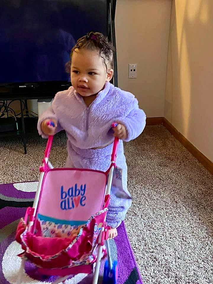 Amira joined the competition — help win amazing prizes! baby, baby_toddler_clothing, child, door, person, pink, play, purple, riding_toy, sled, toddler