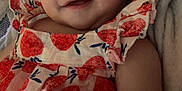 Lucifia joined the competition — help win amazing prizes! baby, blanket, candid, child, closeup, comfort, cute, dress, fruit_pattern, happy, indoors, infant, patterned_clothing, person, portrait, red, relaxing, smiling, soft_texture, young