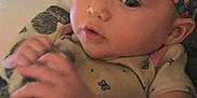 Lucifia is registered to the contest to win money with this photo: baby, infant, headband, floral, blanket, hand, face, eyes, clothing, cute, indoors, person, skin, expression, portrait, newborn, soft, young, child, curious