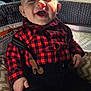 baby, smiling, suspenders, shirt, red_checkered, black_pants, drool, cushion, seat, window, sunlight, indoor, happy, child, face, hand, clothing, infant, person, portrait