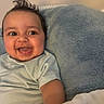 Mason joined the competition — help win amazing prizes! baby, smiling, happy, infant, face, child, blanket, blue_blanket, cute, clothing, short_sleeve, lying_down, indoors, skin, hair, cheeks, tongue, expression, portrait, person