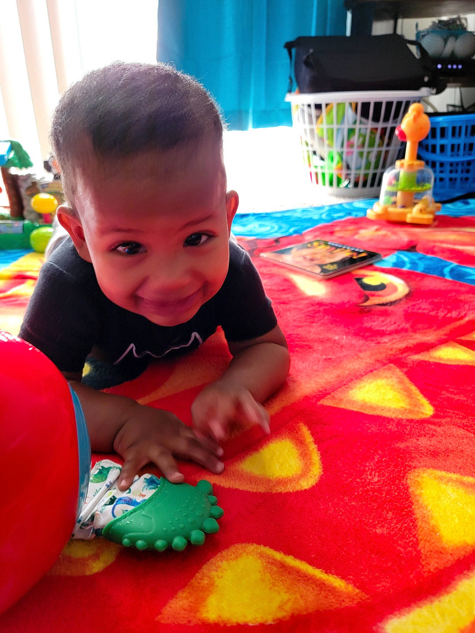 Azaiah is registered to the contest to win money with this photo: art, baby, baby_playing_with_toys, baby_toddler_clothing, baby_toys, child, event, floor, flooring, fun, green, happy, joy, leisure, party, person, play, room, sitting, toddler