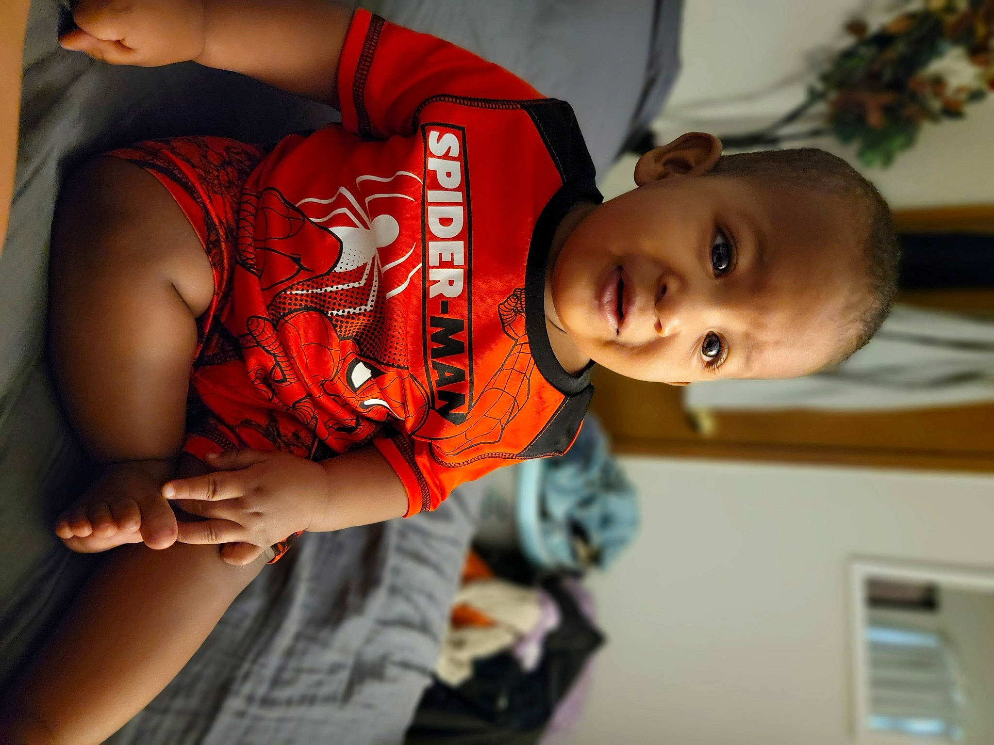 Azaiah is registered to the contest to win money with this photo: abdomen, baby, black_hair, chest, child, elbow, eye, flash_photography, fun, happy, human_body, human_leg, mouth, person, skin, sleeve, t_shirt, thigh, toddler, trunk