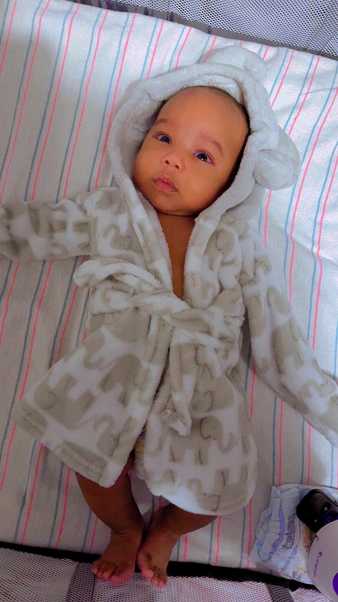 Antoneil joined the competition — help win amazing prizes! adorable, baby, blanket, child, clothing, cute, diaper, elephant_pattern, feet, hood, indoor, infant, lying_down, mesh_sides, portrait, robe, sleeping_area, soft_fabric, striped, toes