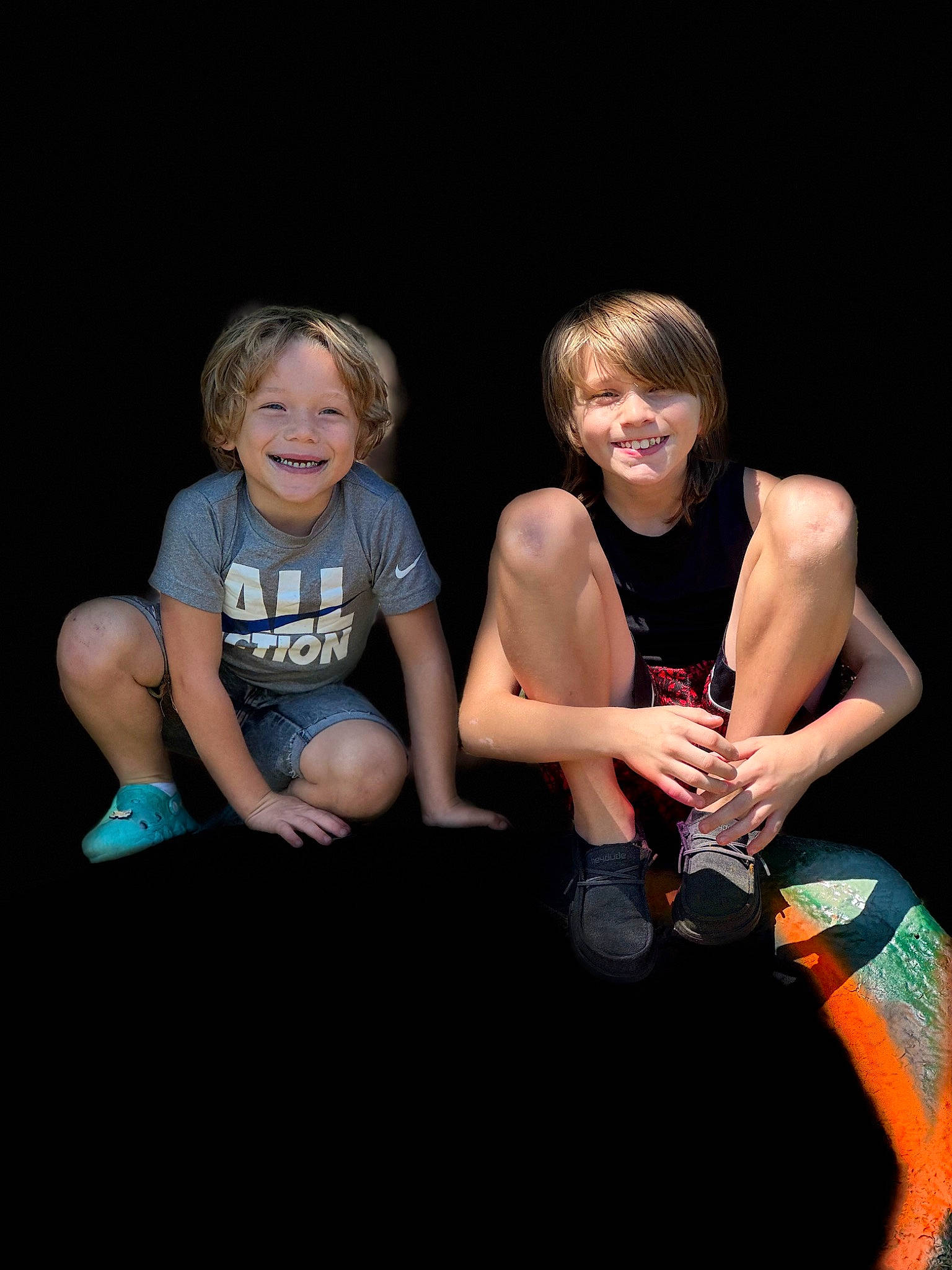 Graylen is registered to the contest to win money with this photo: blond, darkness, drink, entertainment, event, fashion, flash_photography, fun, happy, human_body, human_leg, joy, knee, leg, leisure, performing_arts, person, shorts, sitting, smile