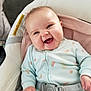 baby, baby_seat, belt, child, chubby_cheeks, closeup, clothing, comfortable, cushion, cute, happy, indoor, infant, onesie, person, portrait, seat, smiling, soft_lighting, watermelon_pattern