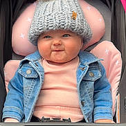 Ellie Bea joined the competition — help win amazing prizes! baby, child, chubby_cheeks, clothing, cozy, cute, denim_jacket, face, fashion, headwear, infant, knit_hat, person, pink_cushion, pom_pom, portrait, seat, smile, stroller, warm_clothes
