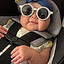 baby, blue_flower, car_seat, casual, child, clothing, cute, denim, hand, headband, indoor, infant, pearl, portrait, reflection, safety_harness, skin, smile, straps, sunglasses