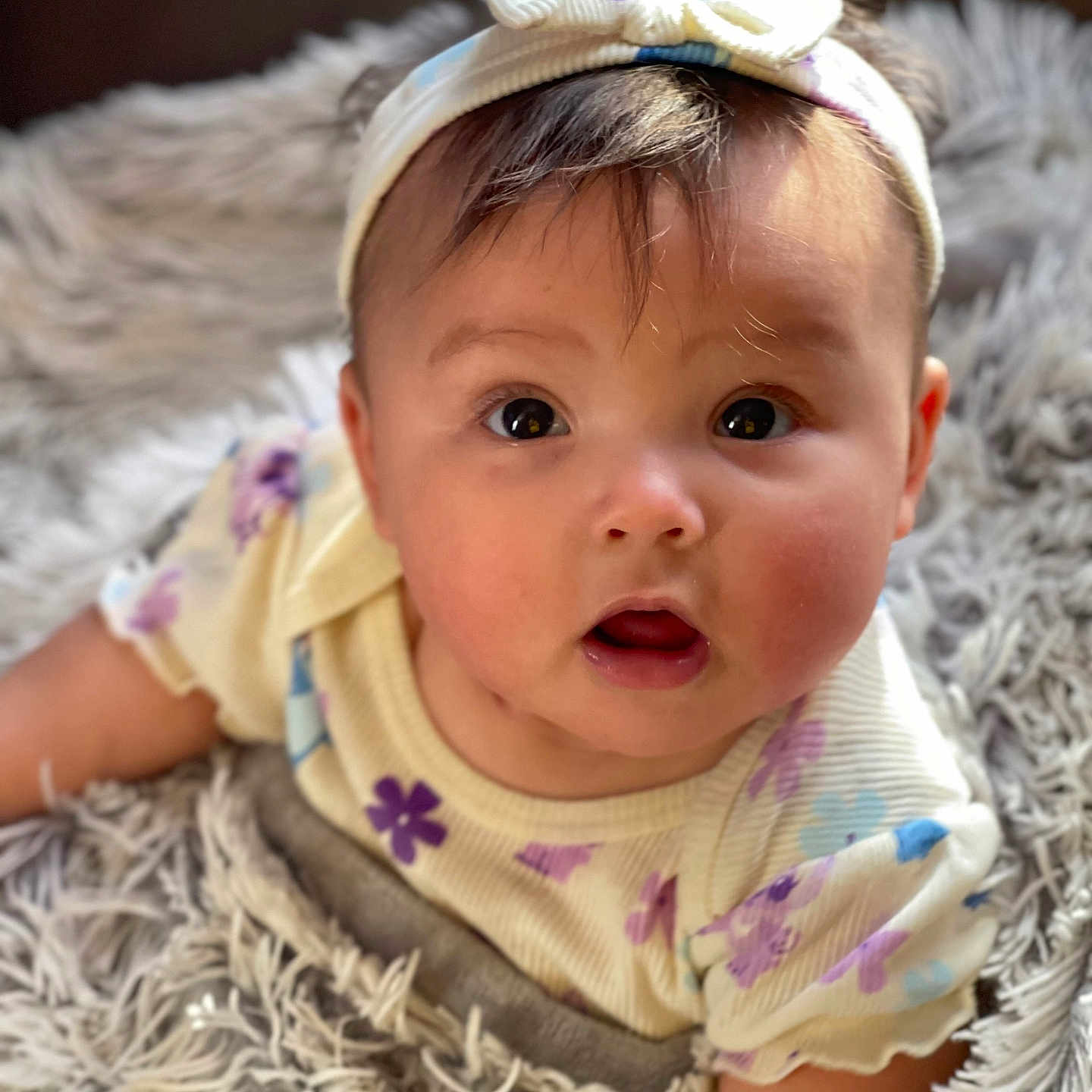 Salise is registered to the contest to win money with this photo: accessories, baby, bodypart, clothing, couch, dress, face, finger, furniture, hand, happy, hat, head, headband, jewelry, newborn, person, photography, portrait, smile