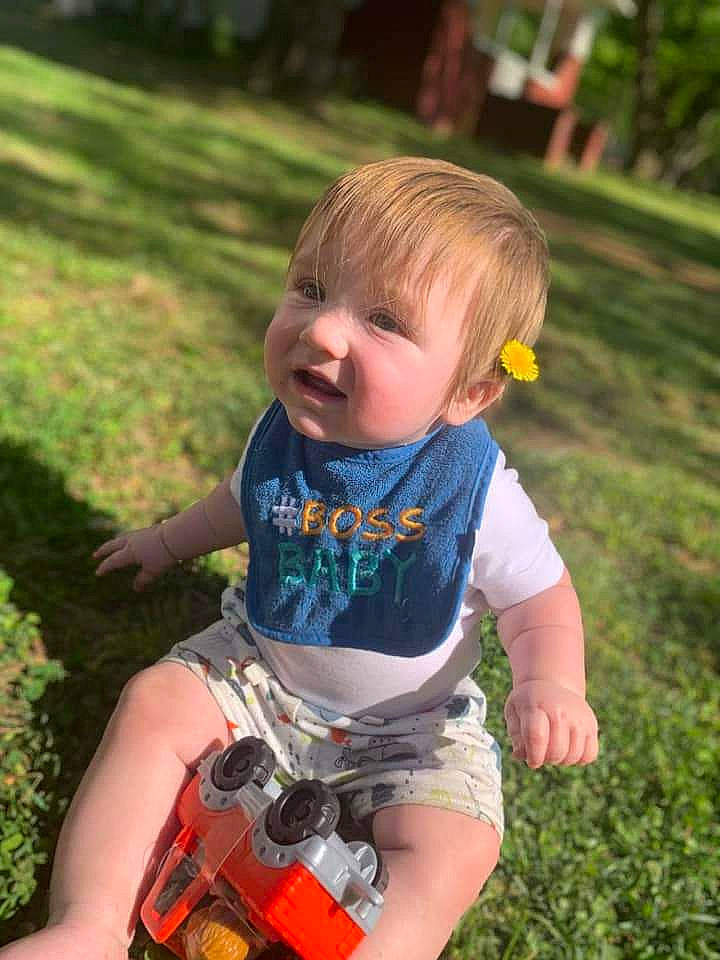 Austin joined the competition — help win amazing prizes! baby_toddler_clothing, botany, child, face, fun, garden, grass, happy, lawn, leaf, leisure, people_in_nature, person, photograph, plant, recreation, shorts, sitting, smile, summer