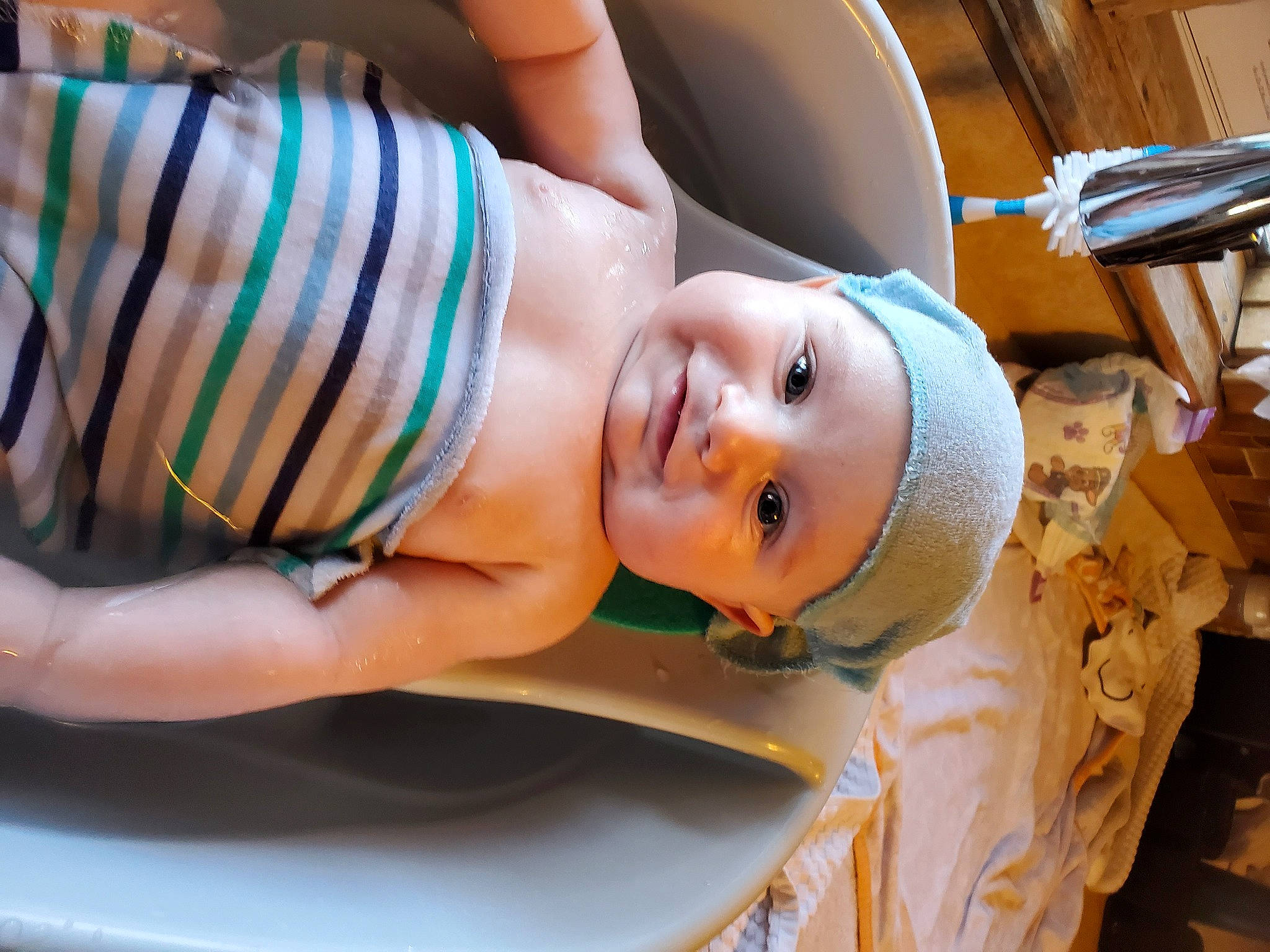 Camdyn is registered to the contest to win money with this photo: abdomen, black_hair, chest, child, elbow, eyelash, food, fun, happy, hat, headwear, human_body, human_leg, leisure, person, sitting, smile, thigh, toddler, toy