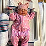 newborn, baby, infant, pink_onesie, bear_hat, sleeping, hospital, bassinet, blanket, footprint_card, striped_blanket, cute, cozy, child, face, person, hospital_bed, toddler, lying_down, headwear