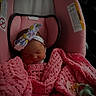 baby, infant, sleeping, car_seat, pink_blanket, headband, pacifier, child, newborn, knitted_blanket, indoors, comfort, cute, peaceful, resting, soft_lighting, portrait, baby_accessories, toddler, closeup