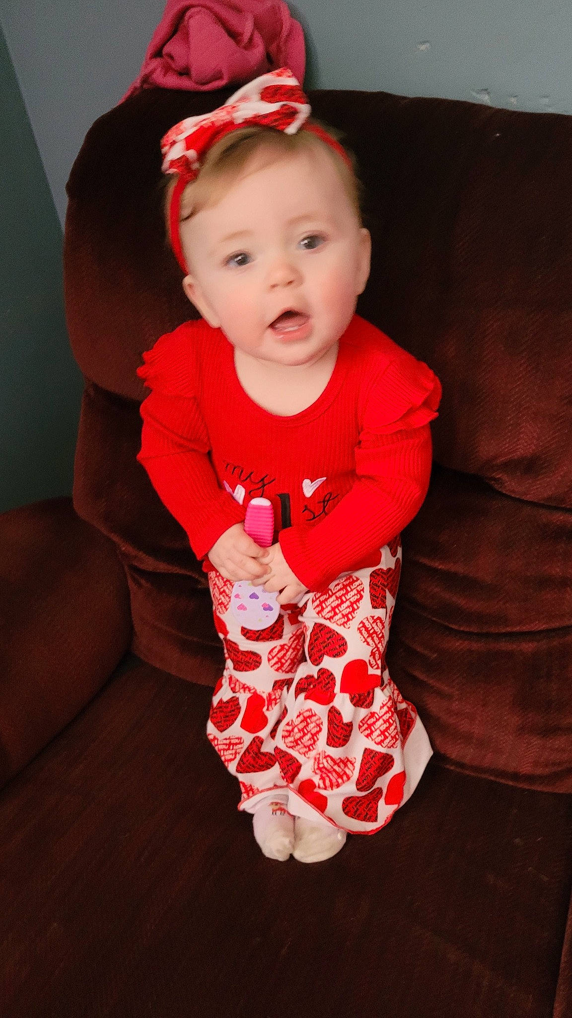 Adalyn joined the competition — help win amazing prizes! baby, baby_toddler_clothing, child, comfort, dress, face, happy, hat, head, human_body, leg, pattern, person, pink, red, sitting, skin, sleeve, smile, sock