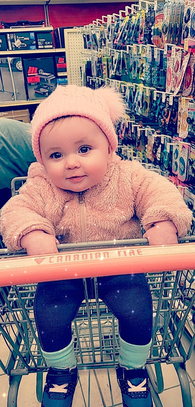 Adalyn is registered to the contest to win money with this photo: baby, baby_toddler_clothing, cap, cheek, cool, design, electric_blue, eye, fun, happy, head, mouth, pattern, person, play, product, shelf, shopping_cart, sleeve, smile