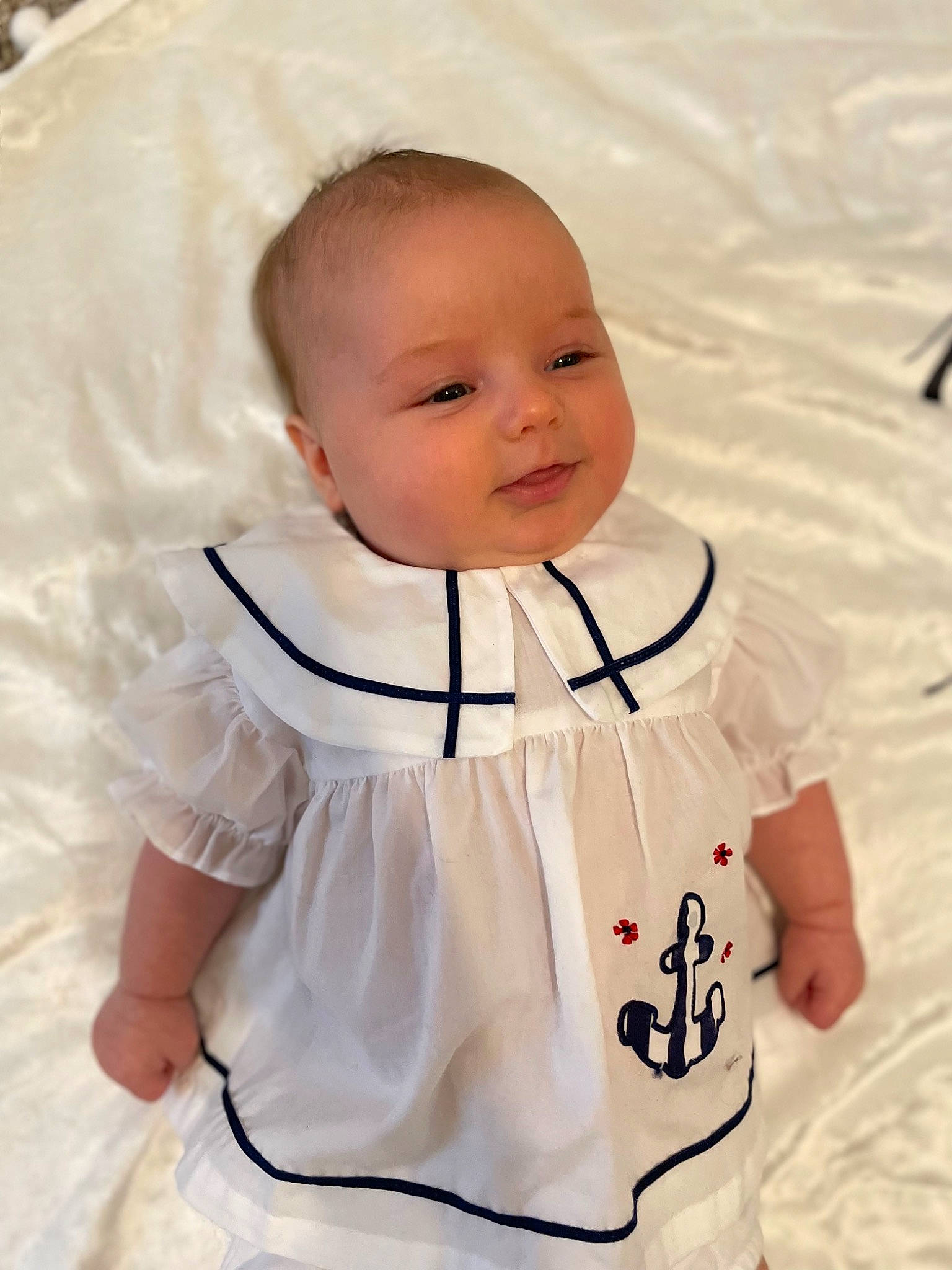 Saylor joined the competition — help win amazing prizes! baby, baby_products, baby_toddler_clothing, cheek, child, collar, comfort, eye, happy, human_body, linens, neck, person, sitting, skin, sleeve, smile, t_shirt, toddler, uniform