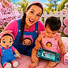 baby, woman, toy, doll, pink, blue, outdoor, flower, grass, headband, smile, happy, child, playing, game_console, celebration, colorful, nature, cute, portrait