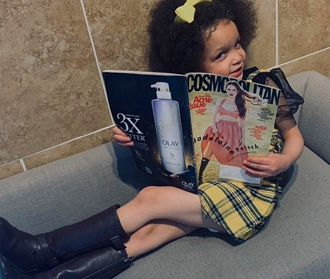 Remedy is registered to the contest to win money with this photo: blurred, book, calf, drink, electric_blue, eyewear, finger, foot, gadget, hand, human_leg, knee, leg, nail, pattern, person, publication, reading, sitting, street_fashion