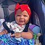 Nami joined the competition — help win amazing prizes! baby, blanket, blue, child, clothing, cute, face, happy, infant, outdoor, patterned_blanket, pink, plush_toy, portrait, red_headband, seat_belt, smile, stroller, sunlight, toy