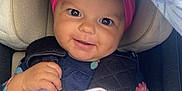 Nami is registered to the contest to win money with this photo: baby, blanket, car_seat, child, clothing, colorful, comfort, cute, face, hand, happy, headband, indoors, infant, pattern, polka_dot, portrait, seatbelt, smiling, toy