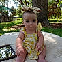 Selena joined the competition — help win amazing prizes! baby, infant, child, outdoor, nature, tree, grass, cushion, mirror, headband, bow, yellow_dress, sunlight, portrait, cute, sitting, greenery, reflection, summer, playful