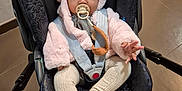 Milaya participe au concours pour gagner de l'argent avec cette photo : baby, stroller, pacifier, pink_hoodie, baby_clothing, child, infant, cute, face, straps, car_seat, indoor, floor, toy, warm_clothing, hand, footwear, expression, seat, person