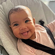 Milaya a rejoint le concours — aidez-le/la à gagner de superbes lots ! baby, child, smiling, tongue_out, seat_belt, baby_seat, indoor, happy, cute, infant, face, person, clothing, pink_outfit, closeup, portrait, skin, head, expression, human