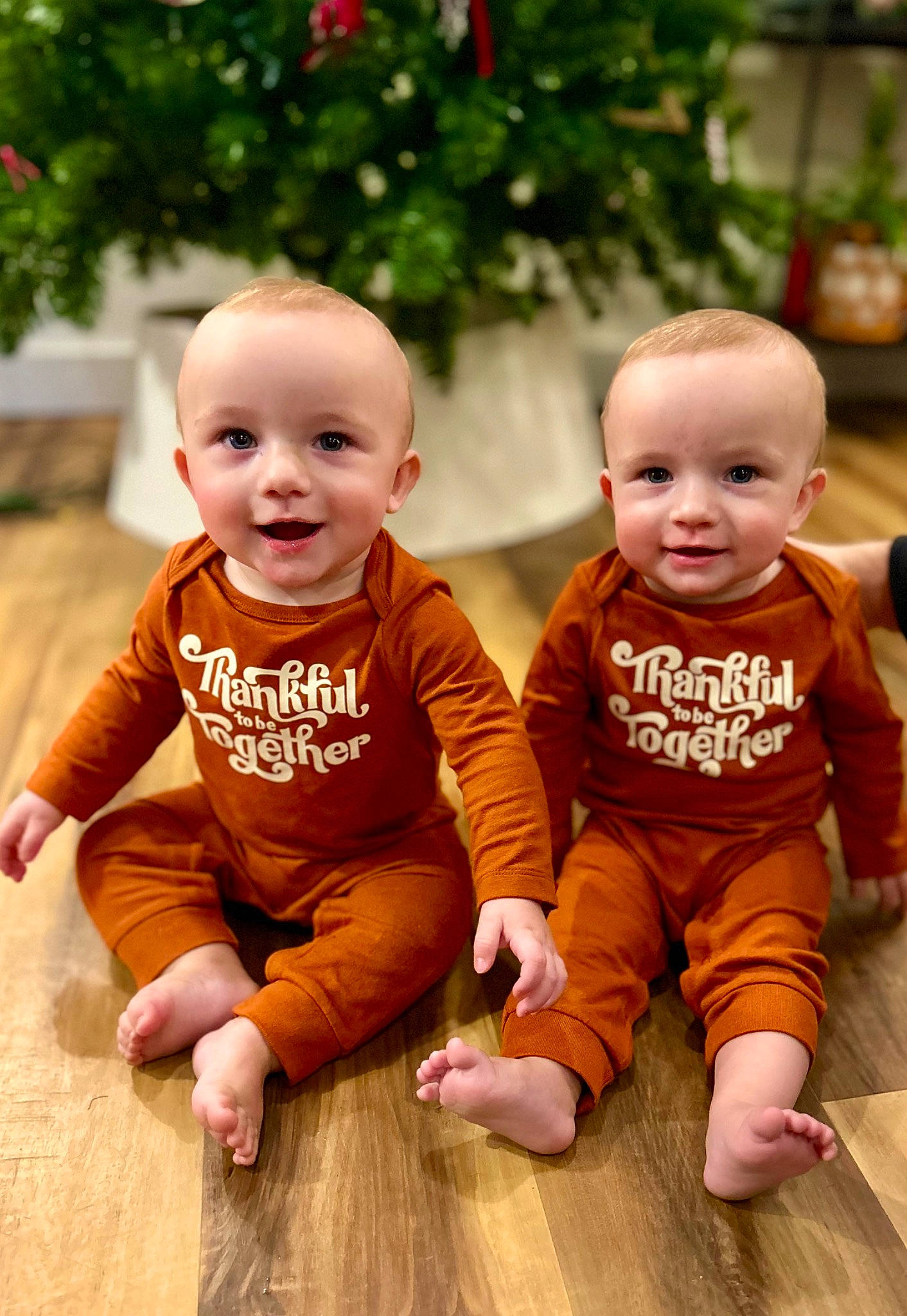 Zeb joined the competition — help win amazing prizes! baby, baby_toddler_clothing, cheek, eye, face, facial_expression, floor, flooring, happy, head, joy, nose, orange, outerwear, people_in_nature, person, photograph, plant, skin, smile