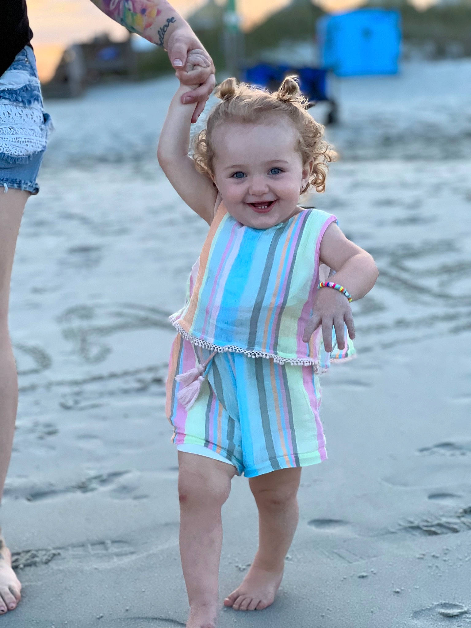 Brynnlee is registered to the contest to win money with this photo: barefoot, beach, blue, body_of_water, child, facial_expression, fun, gesture, happy, joy, leisure, natural_environment, people, people_in_nature, people_on_beach, person, photograph, sand, standing, summer